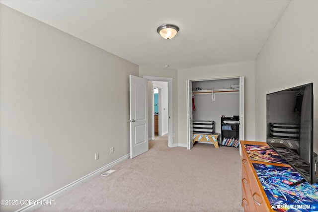 1675 E Pintail Dr, Wasilla, AK 99645 - bedroom featuring light carpet, baseboards, and a closet