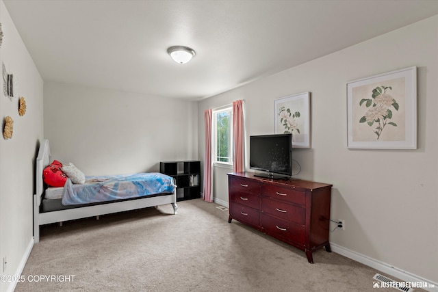 1675 E Pintail Dr, Wasilla, AK 99645 - bedroom featuring light carpet and baseboards