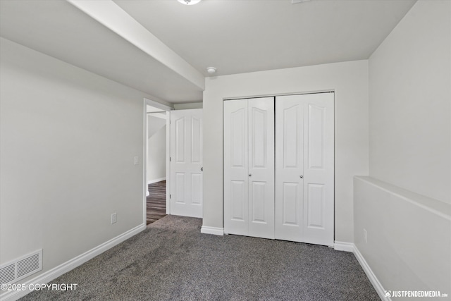 1130 W Granville St, Palmer, AK 99645 - unfurnished bedroom featuring dark carpet, baseboards, and a closet