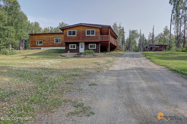 8301 W Lost Valley Rd, Wasilla, AK 99623 - view of front of home featuring driveway and a front lawn