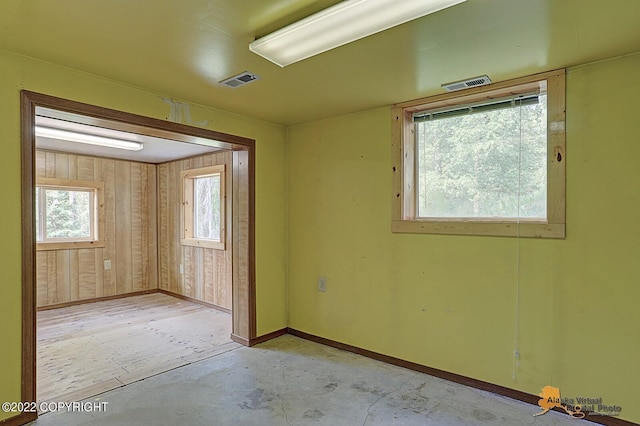 8301 W Lost Valley Rd, Wasilla, AK 99623 - empty room with concrete floors and baseboards