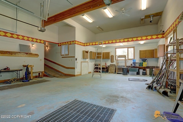 8301 W Lost Valley Rd, Wasilla, AK 99623 - garage with a garage door opener and ceiling fan