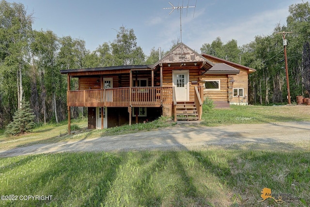 8301 W Lost Valley Rd, Wasilla, AK 99623 - log cabin with log exterior and a deck