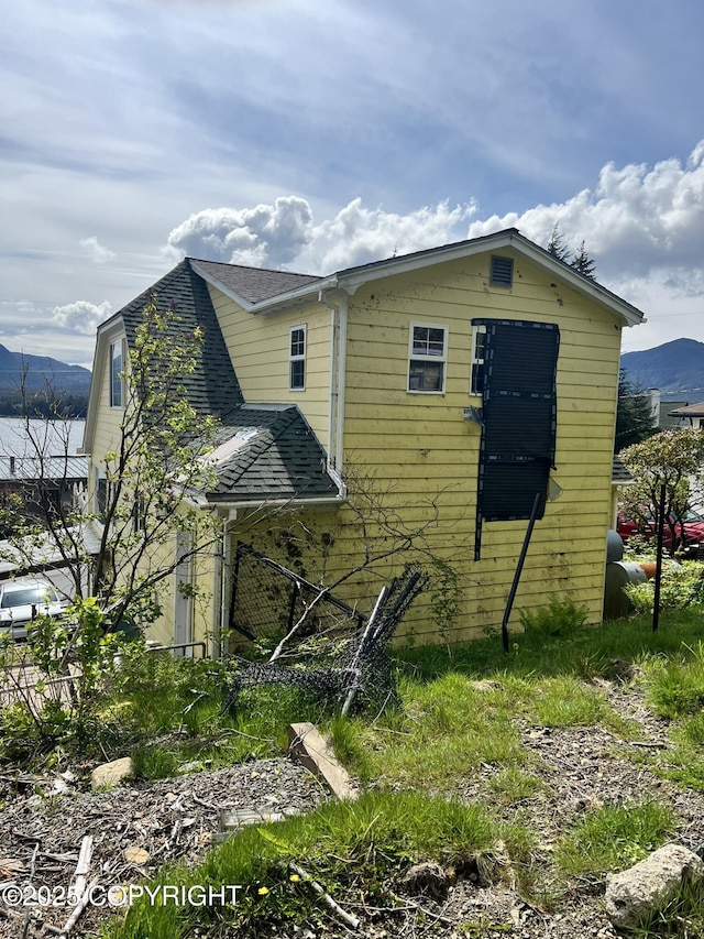 2030 2nd Ave Ave, Ketchikan, AK 99901 - view of side of property featuring a shingled roof and a mountain view