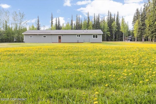 3432 Conifer Dr, North Pole, AK 99705 - back of house featuring a yard