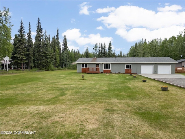 3432 Conifer Dr, North Pole, AK 99705 - view of front of property with asphalt driveway, an attached garage, a front yard, and a wooden deck