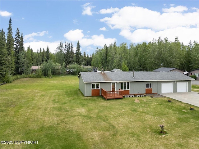 3432 Conifer Dr, North Pole, AK 99705 - view of front facade with an attached garage, a front yard, a wooden deck, and concrete driveway