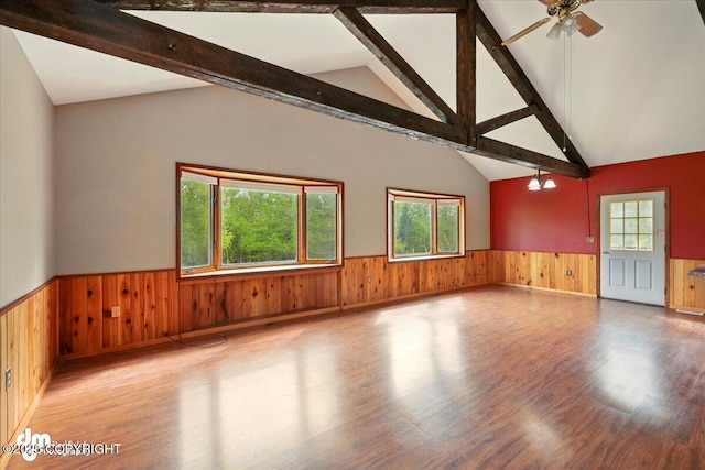 650 N Esty Dr, Palmer, AK 99645 - spare room featuring a wainscoted wall, wood finished floors, wood walls, and a ceiling fan