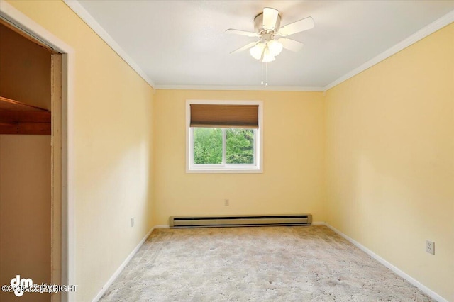 650 N Esty Dr, Palmer, AK 99645 - unfurnished room featuring a baseboard heating unit, a ceiling fan, carpet flooring, crown molding, and baseboards