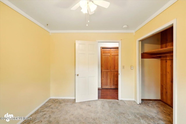 650 N Esty Dr, Palmer, AK 99645 - unfurnished bedroom featuring carpet flooring, crown molding, baseboards, a closet, and a ceiling fan