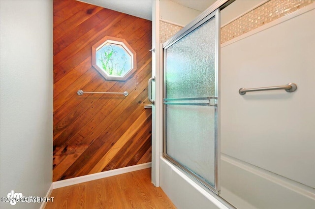 650 N Esty Dr, Palmer, AK 99645 - full bath with wood walls, wood finished floors, and combined bath / shower with glass door