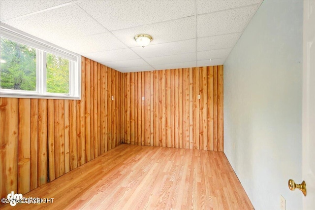 650 N Esty Dr, Palmer, AK 99645 - spare room featuring wood finished floors, wood walls, and a paneled ceiling