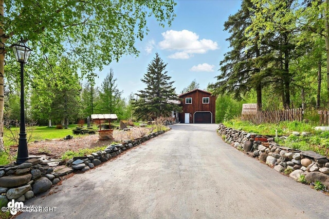 650 N Esty Dr, Palmer, AK 99645 - view of front of house featuring driveway and a detached garage