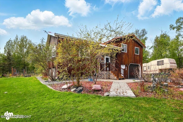 650 N Esty Dr, Palmer, AK 99645 - view of front facade with an attached garage and a front lawn
