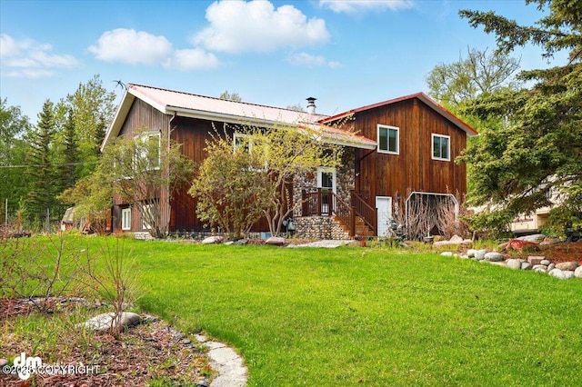 650 N Esty Dr, Palmer, AK 99645 - view of front facade featuring a front lawn and metal roof