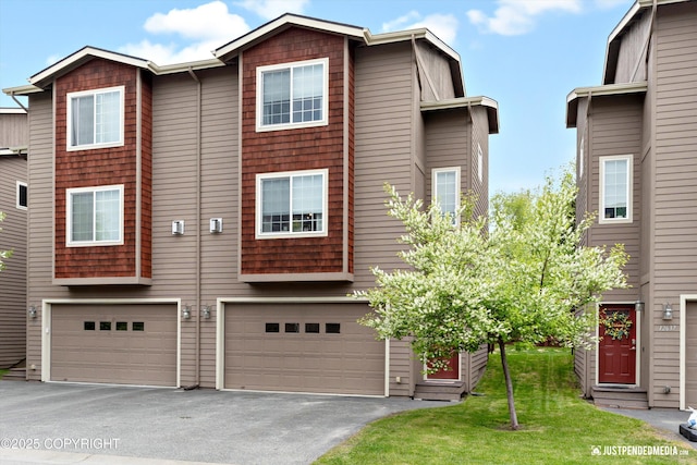 12621 Bona Kim Loop # 4, Anchorage, AK 99515 - view of property featuring an attached garage and driveway