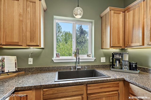 12621 Bona Kim Loop # 4, Anchorage, AK 99515 - kitchen with a sink, dark countertops, and pendant lighting
