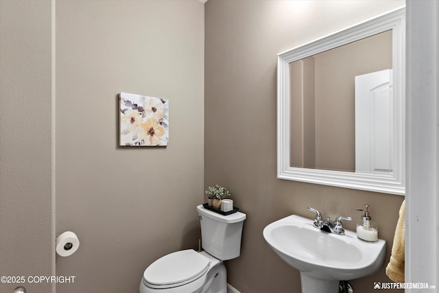 12621 Bona Kim Loop # 4, Anchorage, AK 99515 - bathroom featuring toilet and a sink
