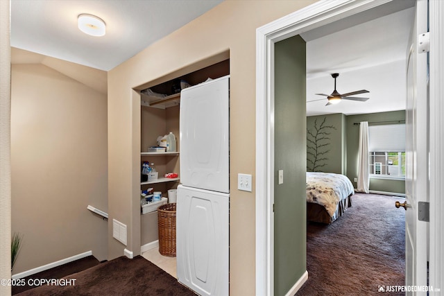 12621 Bona Kim Loop # 4, Anchorage, AK 99515 - hall featuring stacked washer / drying machine, carpet flooring, baseboards, and an upstairs landing