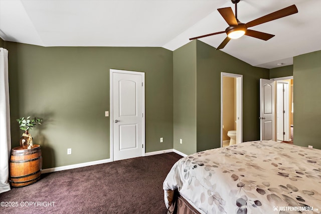 12621 Bona Kim Loop # 4, Anchorage, AK 99515 - bedroom featuring lofted ceiling, dark colored carpet, baseboards, ensuite bath, and a ceiling fan