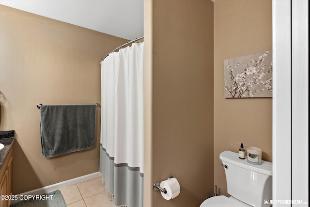 12621 Bona Kim Loop # 4, Anchorage, AK 99515 - bathroom featuring vanity, toilet, and tile patterned flooring