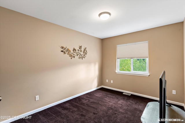 12621 Bona Kim Loop # 4, Anchorage, AK 99515 - empty room with baseboards and dark colored carpet
