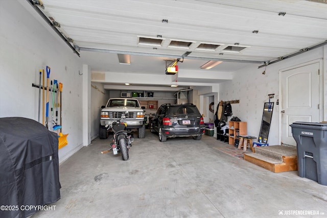12621 Bona Kim Loop # 4, Anchorage, AK 99515 - garage with a garage door opener