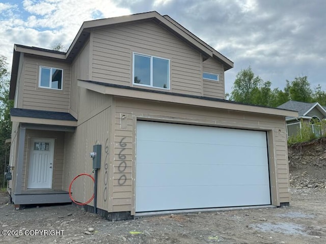 6600 S Settlers Bay Dr, Wasilla, AK 99654 - view of front of house featuring a garage