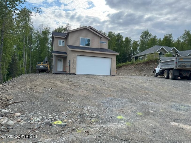 6600 S Settlers Bay Dr, Wasilla, AK 99654 - view of front of property featuring a garage and driveway