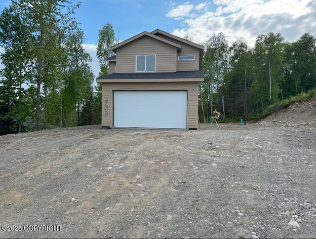 6600 S Settlers Bay Dr, Wasilla, AK 99654 - view of front of house featuring an attached garage and driveway