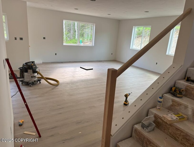 6600 S Settlers Bay Dr, Wasilla, AK 99654 - stairway featuring healthy amount of natural light and wood finished floors