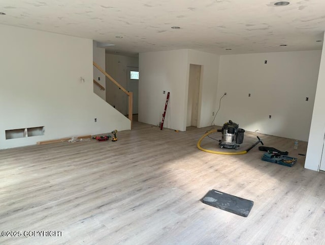 6600 S Settlers Bay Dr, Wasilla, AK 99654 - unfurnished room featuring wood finished floors and stairway