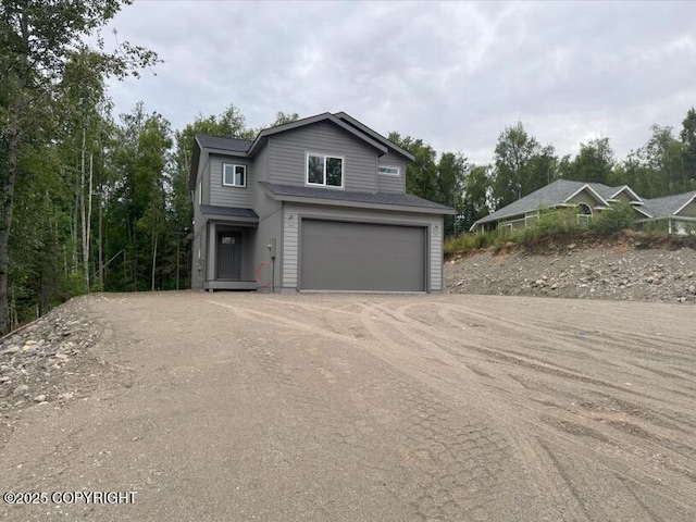 6600 S Settlers Bay Dr, Wasilla, AK 99623 - traditional-style home featuring an attached garage and dirt driveway
