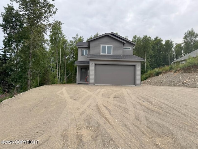 6600 S Settlers Bay Dr, Wasilla, AK 99623 - view of front facade featuring a garage and driveway