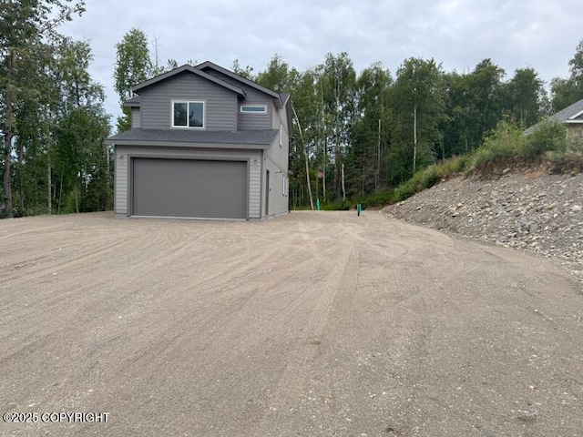 6600 S Settlers Bay Dr, Wasilla, AK 99623 - garage with dirt driveway