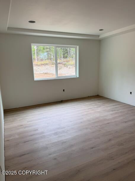 6940 W Werner Dr, Wasilla, AK 99654 - spare room with wood finished floors