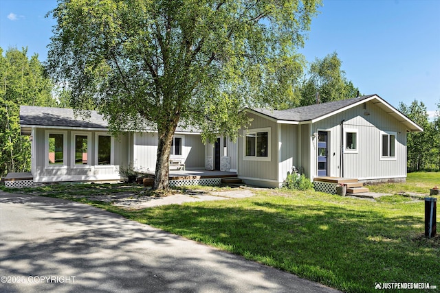 1551 S Oat St, Wasilla, AK 99654 - view of front of home with a front lawn and a shingled roof