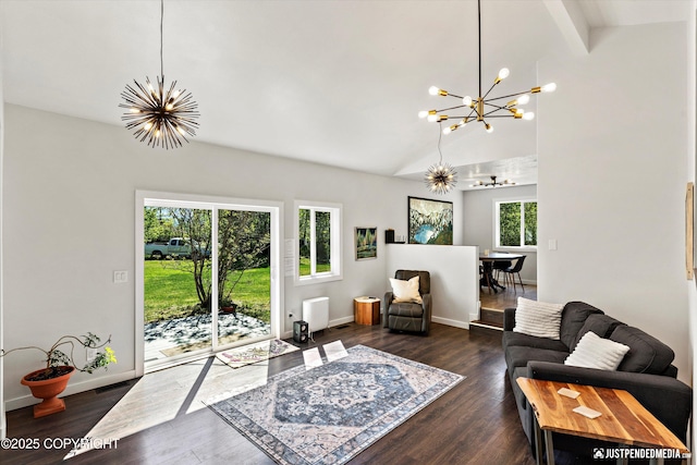 1551 S Oat St, Wasilla, AK 99654 - living room featuring a chandelier, dark wood-type flooring, baseboards, radiator heating unit, and high vaulted ceiling