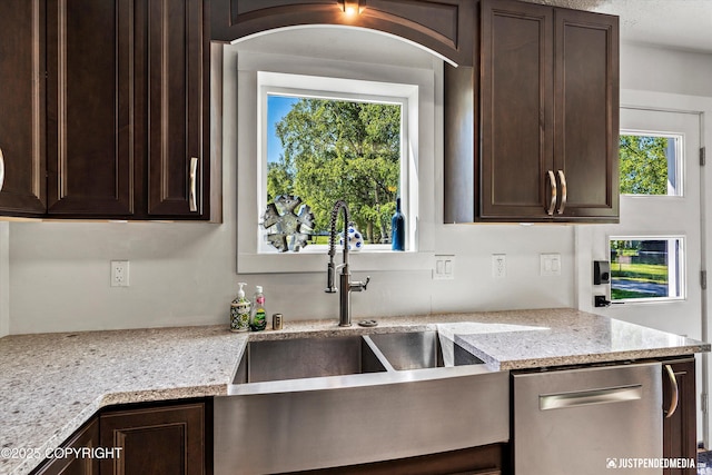 1551 S Oat St, Wasilla, AK 99654 - kitchen with dishwasher, dark brown cabinetry, and a sink