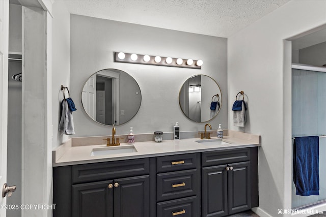 1551 S Oat St, Wasilla, AK 99654 - bathroom with double vanity and a textured ceiling