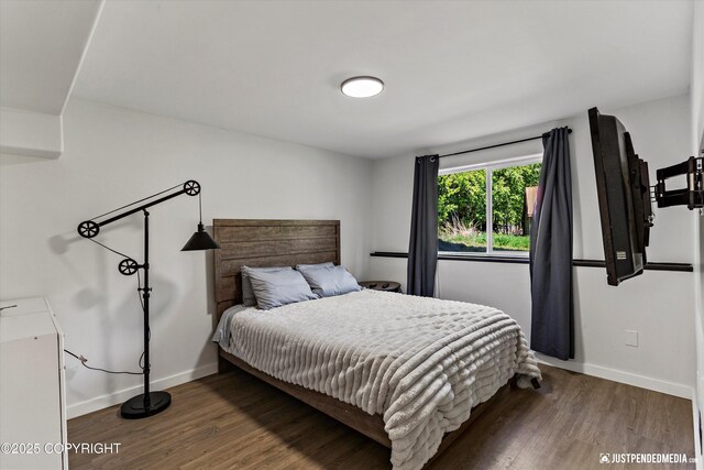 1551 S Oat St, Wasilla, AK 99654 - bedroom with baseboards and wood finished floors