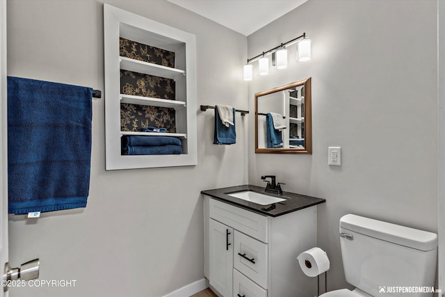 1551 S Oat St, Wasilla, AK 99654 - bathroom featuring vanity and toilet