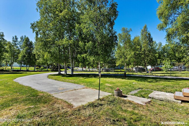 1551 S Oat St, Wasilla, AK 99654 - view of home's community featuring a lawn