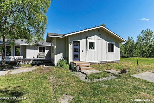1551 S Oat St, Wasilla, AK 99654 - view of front of house with a front yard and a wooden deck