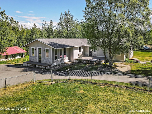 1551 S Oat St, Wasilla, AK 99654 - view of front of house with board and batten siding