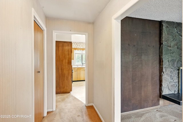 7101 Omalley Rd, Anchorage, AK 99507 - hallway featuring light colored carpet and baseboards
