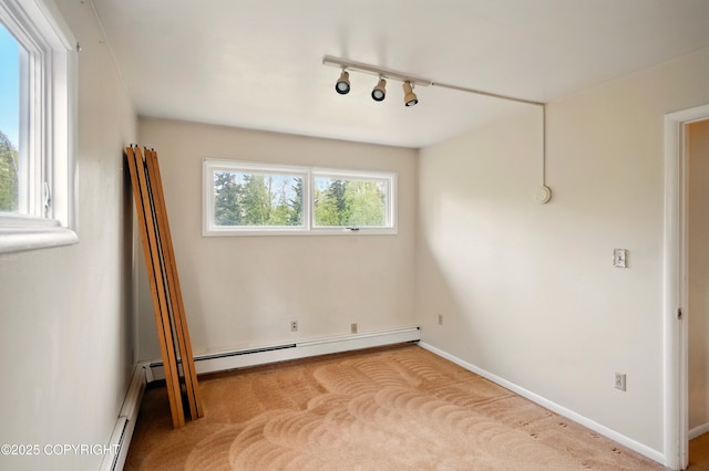 7101 Omalley Rd, Anchorage, AK 99507 - empty room with a baseboard heating unit, baseboards, and carpet