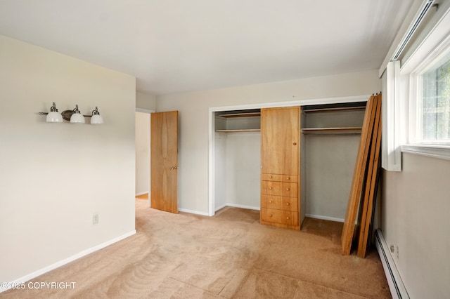 7101 Omalley Rd, Anchorage, AK 99507 - unfurnished bedroom with light carpet, a closet, baseboard heating, and baseboards