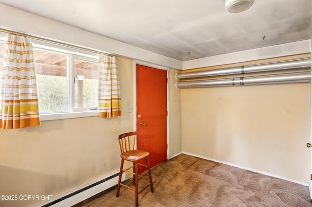 7101 Omalley Rd, Anchorage, AK 99507 - unfurnished room with carpet, a baseboard heating unit, and baseboards