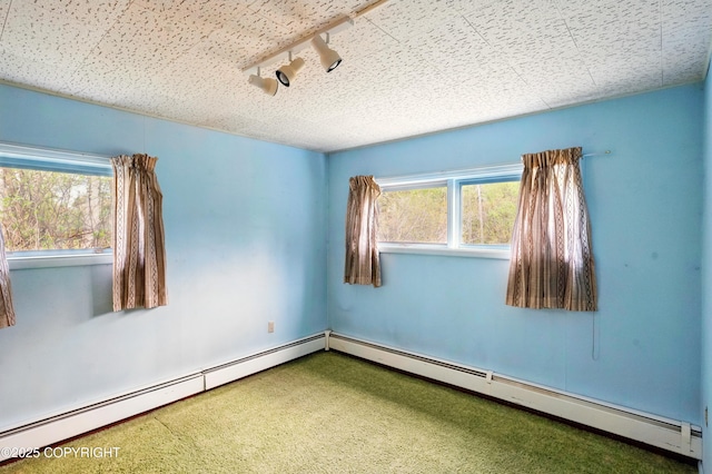 7101 Omalley Rd, Anchorage, AK 99507 - spare room featuring healthy amount of natural light, carpet, and baseboard heating